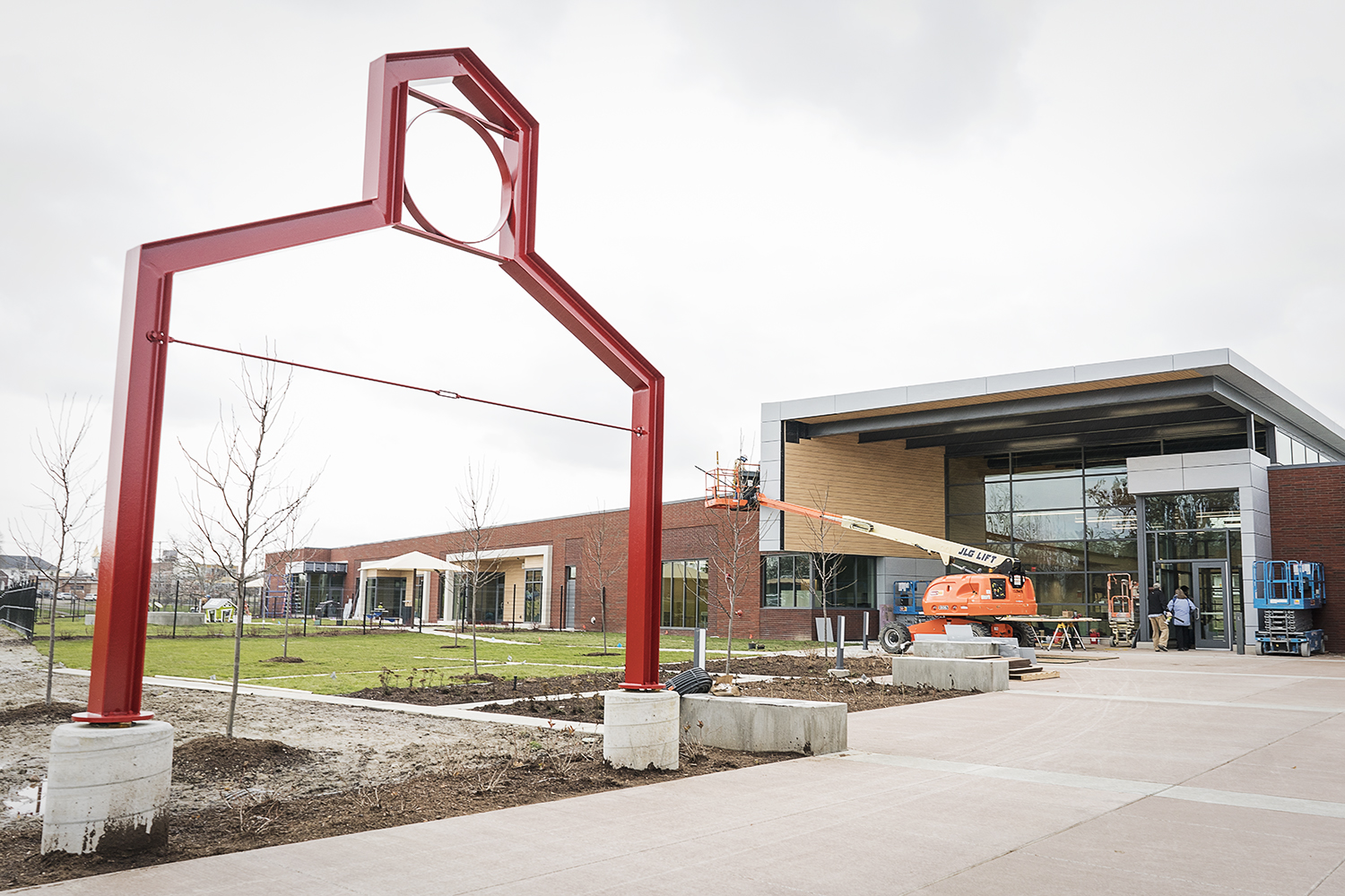 Flint, MI - Tuesday, November 21, 2017: Workers put the finishing touches on the entryway of the new Educare Center in Flint.