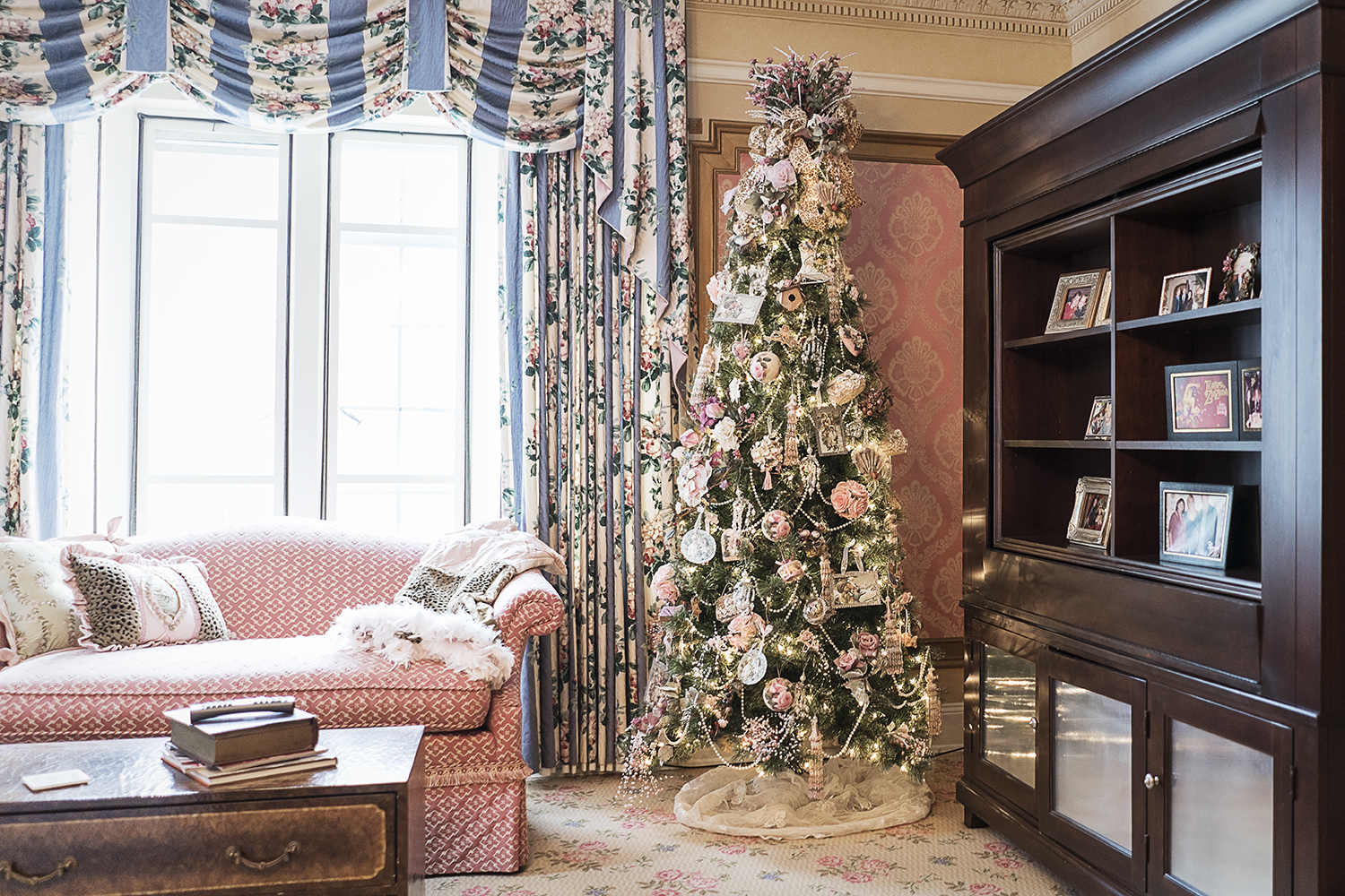 A Victorian-style Christmas tree stands in the corner of the Heddy's bedroom in their home.