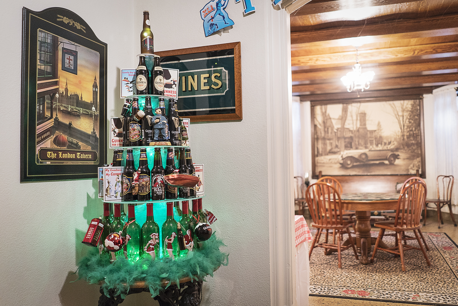 A Christmas tree made of beer bottles stands in a corner of the basement pub in the Heddy home.