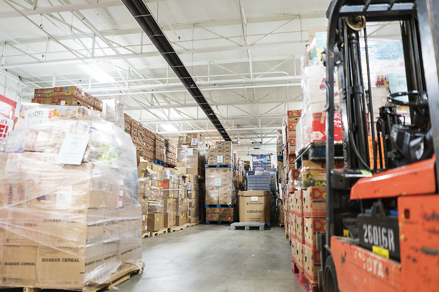 Pallets and pallets full of food wait to be inspected, sorted and shipped in the warehouse of the Food Bank of Eastern Michigan.