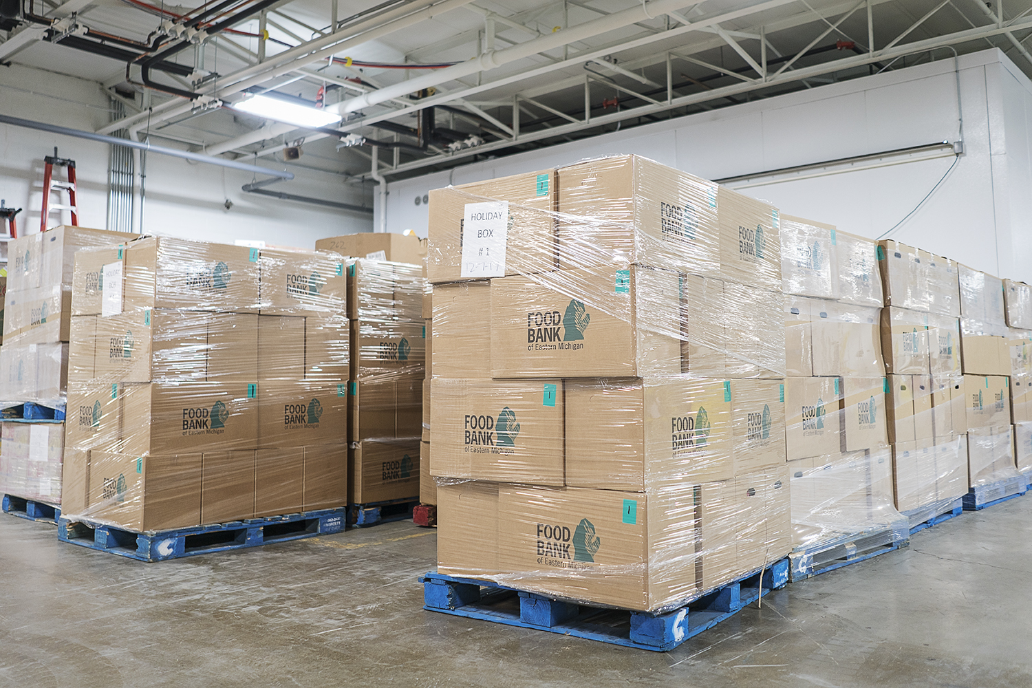 Large boxes full of food for holiday meals await transport at the Food Bank of Eastern Michigan.