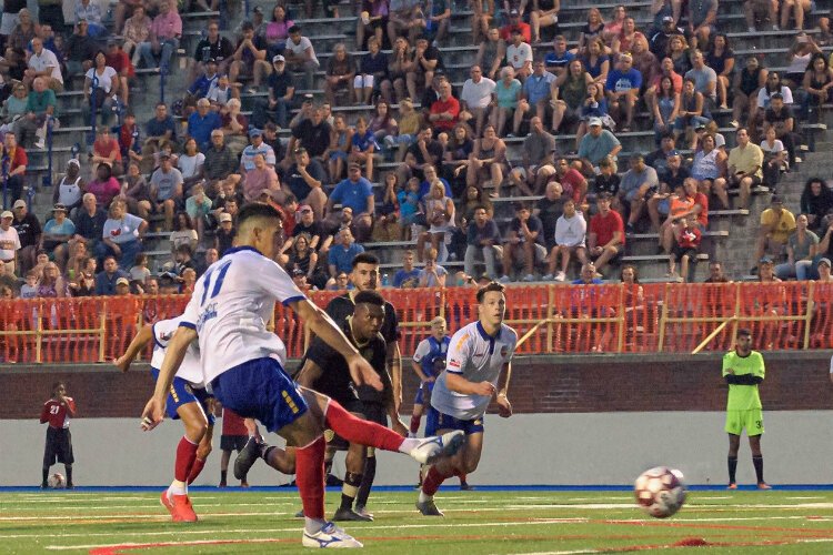 Yuri Farkas delivers the game-winning penalty kick July 27, 2019, to carry the Bucks to the national championship. 