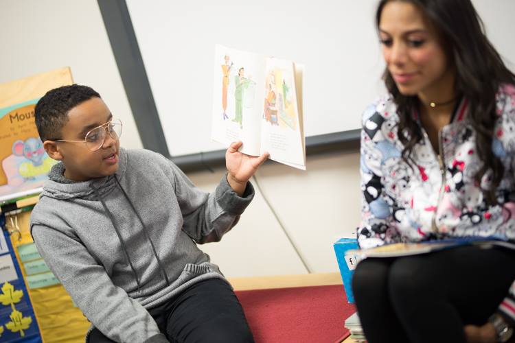  Kevelin B. Jones III and Alejandra Matos read to students at Doyle-Ryder as part of a visit from "The Bodyguard" cast and crew.