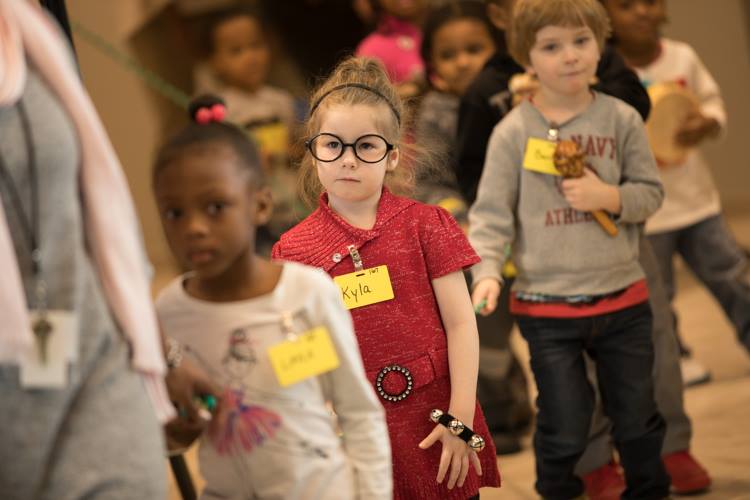 Students at Educare Flint get ready to perform during the grand opening celebration Monday, Dec. 11, 2017. 