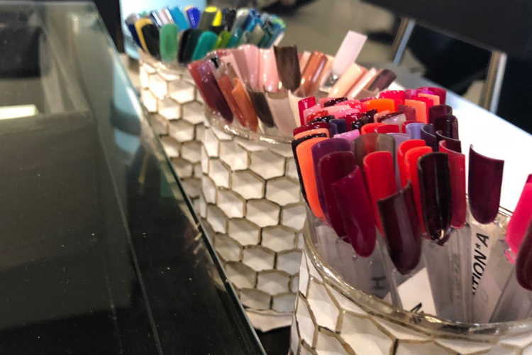 The shellac nail color choices on display at Eight Ten Nail Bar, which opened in May 2018. 