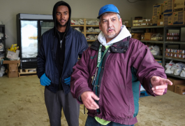 Adil Mohammed (right) and employee Tahj Moore-Parnell help as Food Bank of Easterrn Michigan delivers more food to the Flint Muslim Food Pantry. Located in the Insight building on South Saginaw Street, the pantry serves the whole community.