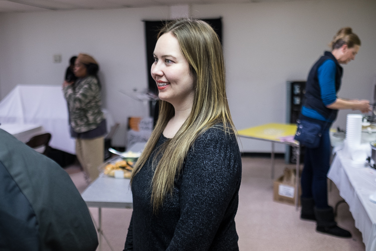 Flint SOUP  founder Adrian Montague speaks with a patron  at the Flint SOUP event in January 2018 at the Church of the Harvest International  in Flint.