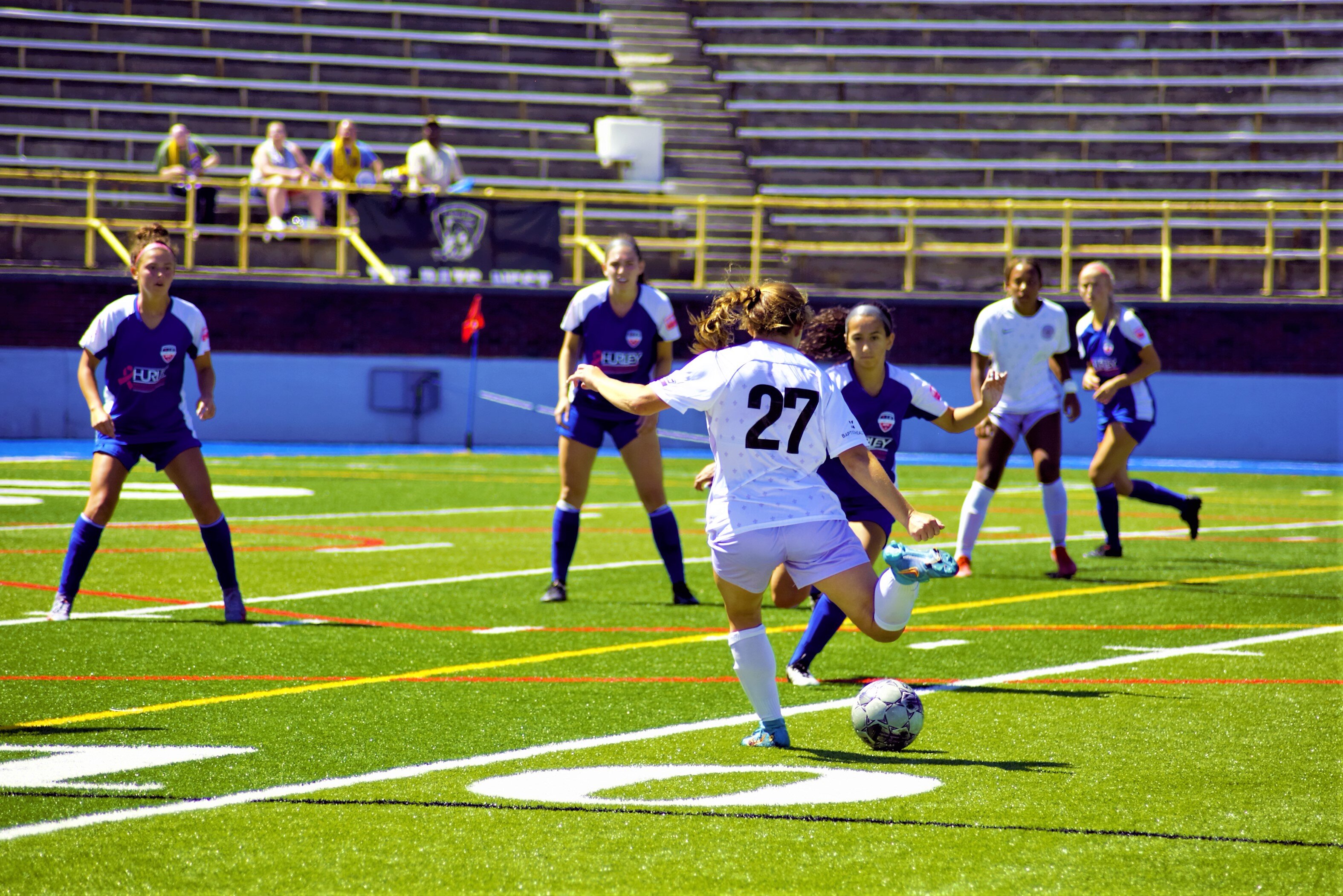 The Flint City AFC playing a tough game against the Racing Louisville FC team.