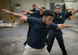 Gianni Love, 19, of Flint Township, rehearses a step-dance routine with other members of the Alpha Esquires at the Mott Community College Workforce Center on North Saginaw Street in Flint earlier this month.