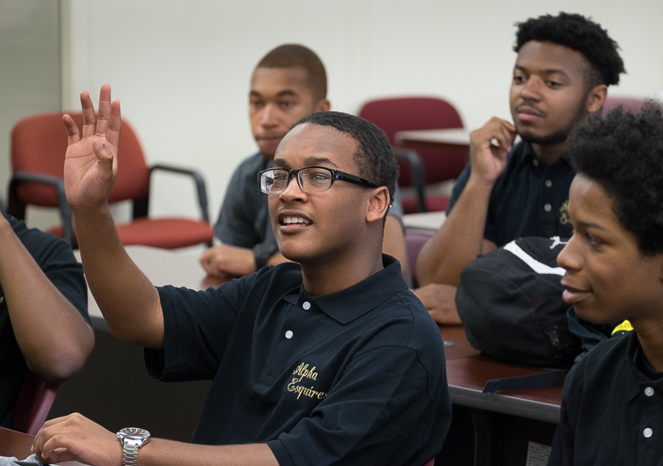 Alpha Esquires member Isaiah Hill, 15, of Flint, asks a question during one of the group's meetings.