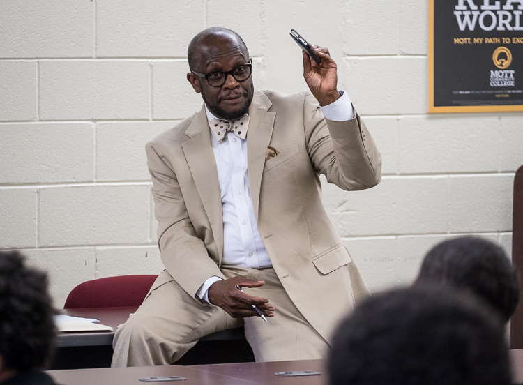 Advisor Sam Wells conducts the Alpha Esquires meeting June 19, 2017, at the Mott Community College Workforce Center on North Saginaw Street. 