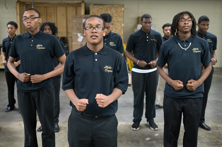 Isaiah Hill, 15, of Flint, rehearses a step-dance routine with  other members of the Alpha Esquires.