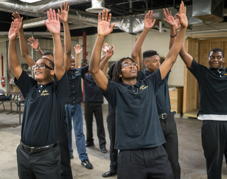 Isaiah Hill, 15, of Flint, (left) and Eric Owens II, 16, of Flint, rehearse a step-dance routine with  other members of the Alpha Esquires, which are celebrating their 20th anniversary.