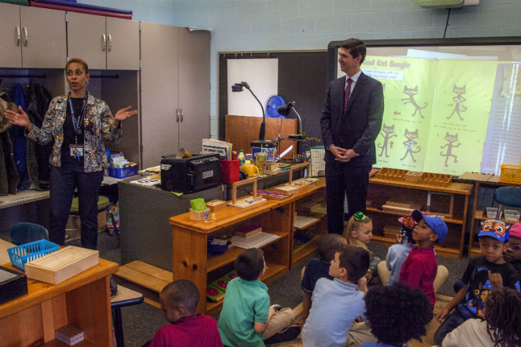 Chester Spellman, director of AmeriCorps for the Corporation for National and Community Service, toured Durant-Tuuri-Mott Elementary School during a visit to highlight the unique nature of AmeriCorps programming in Flint.