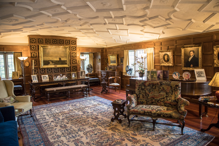 The living room features a unique curved plaster ceiling—and remains true to its original 1916 decor. 