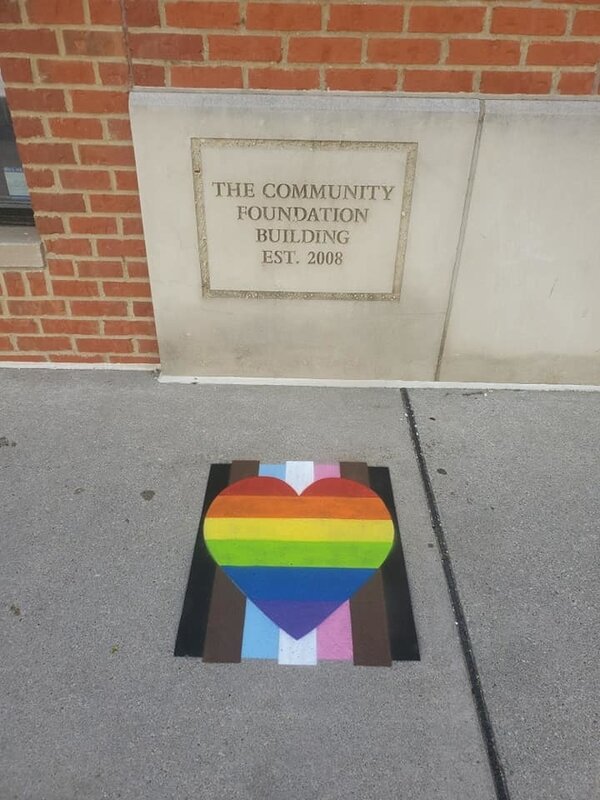 Ten “Pride” hearts painted in locations around Flint, celebrating Pride Month in June