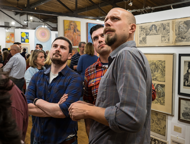 Jon Sherman of Clarkston (left), William Beers of Grand Blanc, and Brice Liljeblad of Holly (who is a grandson of Stefan Davidek) visit the Stefan Davidek retrospective exhibit at Buckham Gallery in Flint at the opening of the show as part of ArtWalk