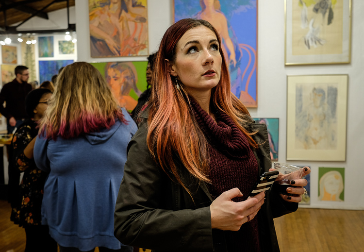 Jessica Beers of Grand Blanc studies a work by Stefan Davidek at the Stefan Davidek retrospective exhibit at Buckham Gallery in Flint. The show opened as part of ArtWalk in October.