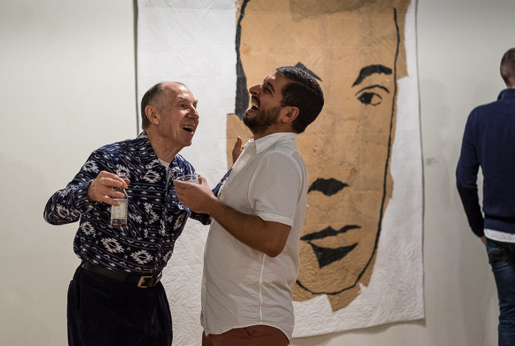 Jerome Wolbert of Mundy Township (left) and Paul Fox of Flint share a laugh at the Greater Flint Arts Council in Flint during ArtWalk. "I love ArtWalk," says Fox.