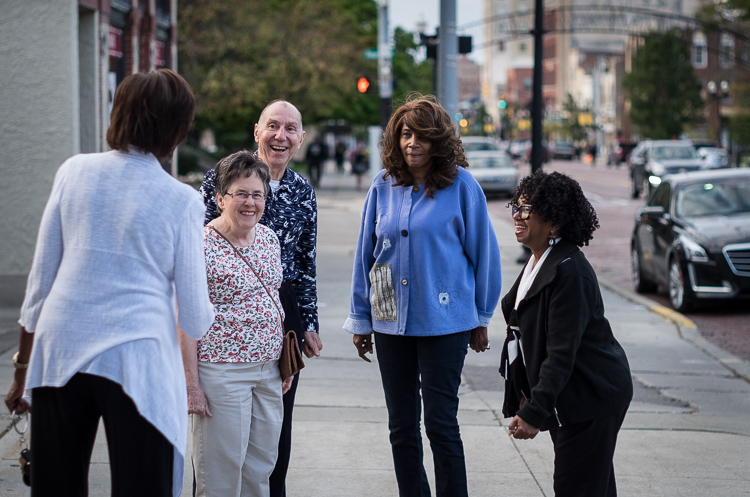 Visitors to ArtWalk reconnect outside the Greater Flint Arts Council in Flint during October's event. The couple at near left are Jerome and Judy Wolbert of Mundy Township.