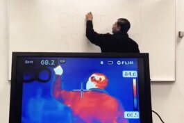 Rajib Ganguly, Ph.D., associate chair of the physics department at UM-Flint, shows how an infrared camera works.