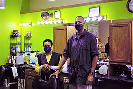 Flint barber Rene Dickson and owner Maurice Dantzler inside Big Daddy's Barber Shop.