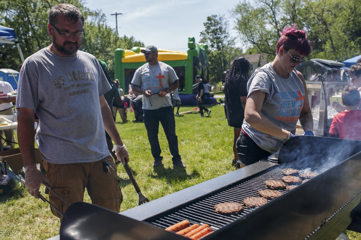 Volunteers grilled hamburgers and hot dogs during a barbecue on June 5.