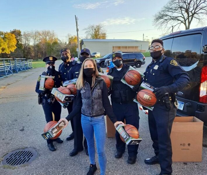 Anne-Marie Blaney and the Flint Police Department passed out basketballs to Flint kids at Berston Fieldhouse.