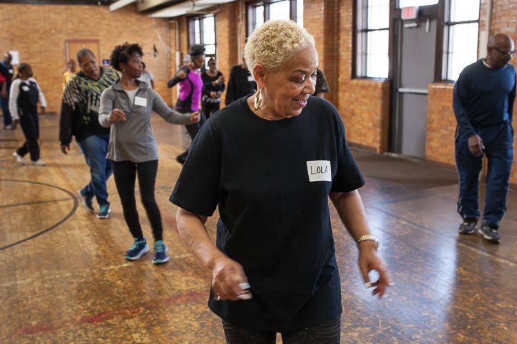 Lola Carter of Flint goes through the steps during a line dancing class at Berston Field House in Flint. The class is mostly women but there were three or four men  also dancing on this day. 