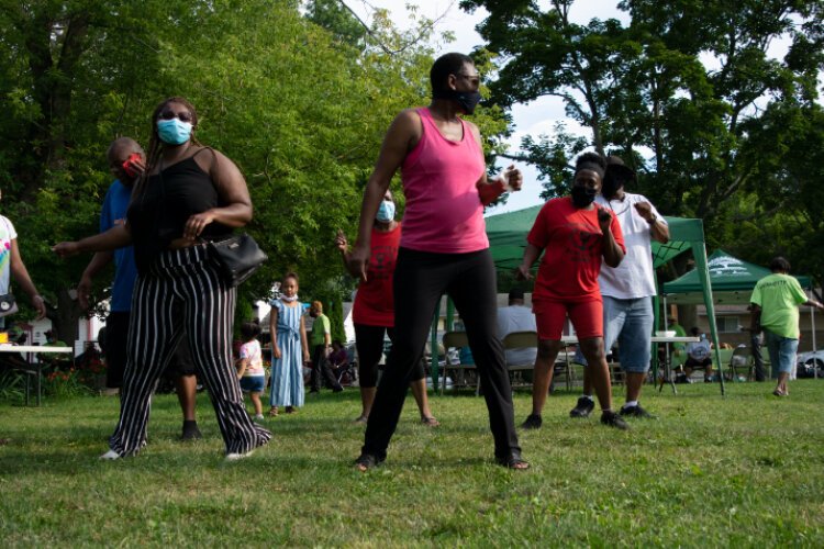 Brownell-Holmes residents do the Cupid Shuffle in Logan Park.