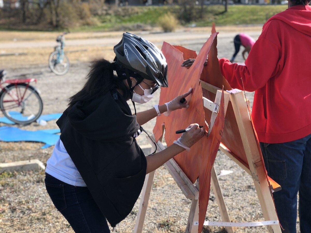Artists, parents, and other community members helped kids paint and design "silly bikes" for a parade on November 7.