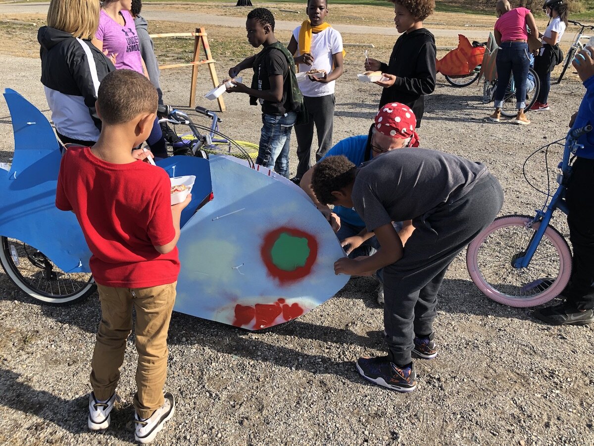 Artists, parents, and other community members helped kids paint and design "silly bikes" for a parade on November 7.