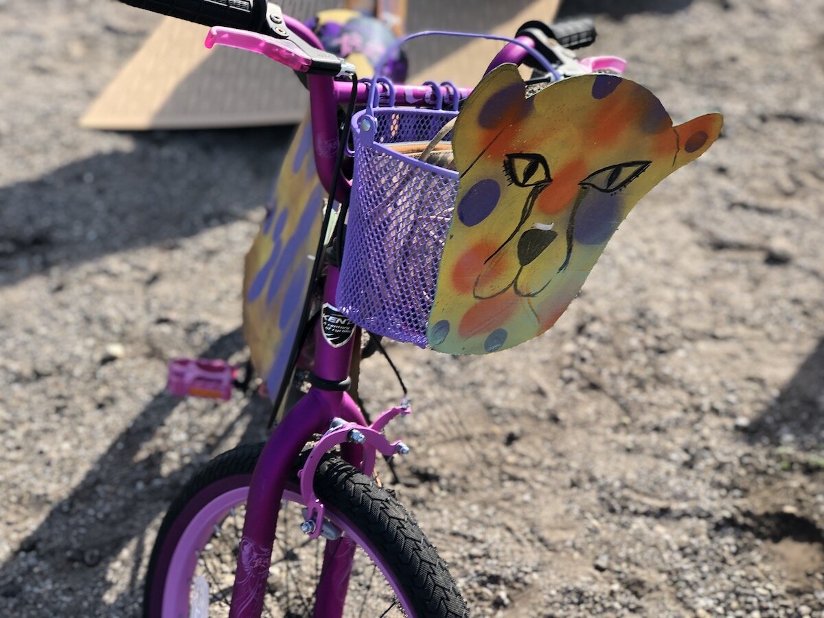 Artists, parents, and other community members helped kids paint and design "silly bikes" for a parade on November 7.