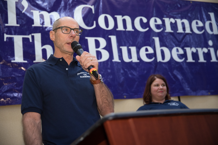 Blueberry Founder Phil Shaltz and Marjory Raymer, publisher and managing editor of Flintside, on stage during the awards.