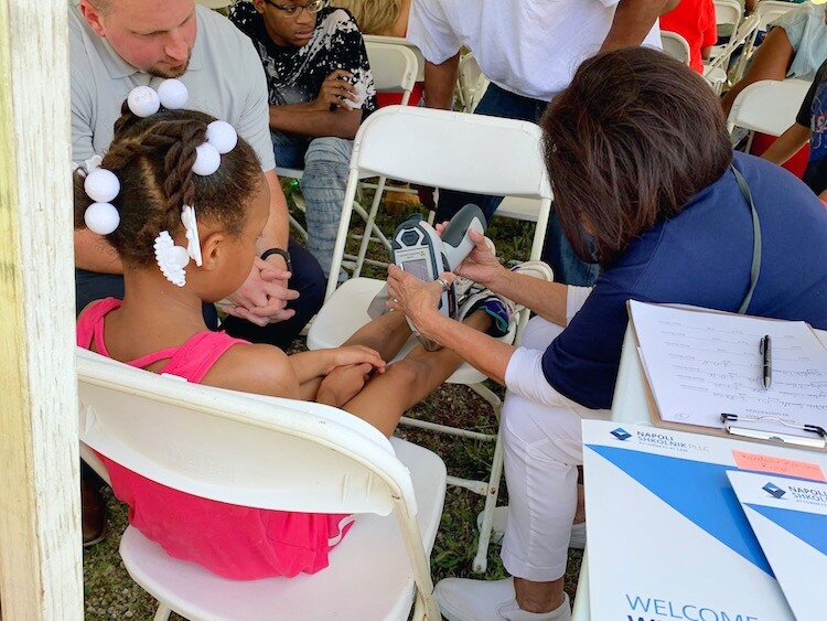 A child receives bone density testing offered by Napoli Shkolnik, a New York-based personal injury attorney lawyer who is pursuing Flint water crisis lawsuits. 