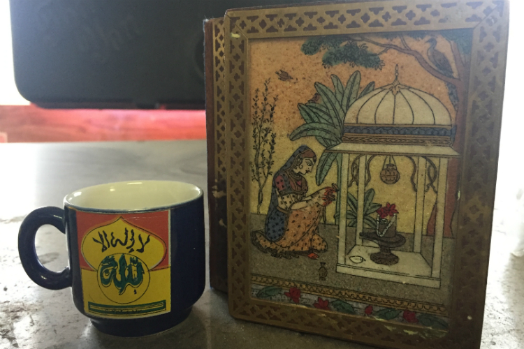 "This box is a Catholic saint ... and this cup says, ‘Allah.’ This says to people coming in, everyone is welcome,” says Marwan Hamade.