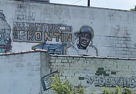 A mural honoring MC Breed is located near Fox Street and Glenwood Avenue in Flint.