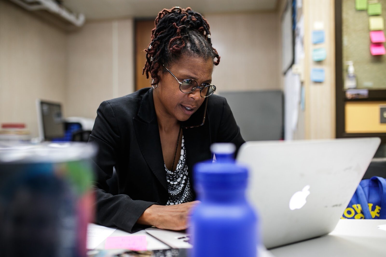 Principal Shalonda Byas multi-tasks while working in her office on Thursday, Aug. 18, 2022, at Brownell STEM Academy.