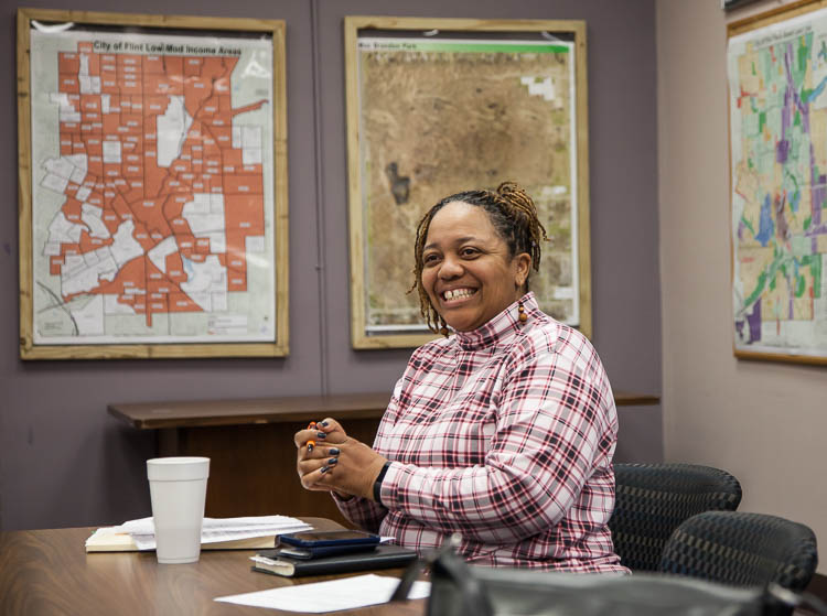 Carma Lewis brings personality, joy and deep commitment to her work at the Neighborhood Engagement Hub on Martin Luther King Avenue in Flint.