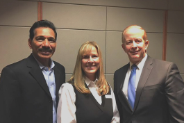 Outgoing Metro Community president Ravi Yalamanchi (left) poses with board chair Rachelle Kippe and new MCD CEO Brian Glowiak.