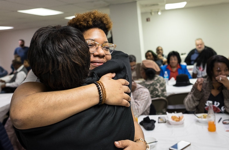 Talicia Campbell, owner of Chef Telly, receives congratulations after winning the microgrant at the Flint SOUP event in January.