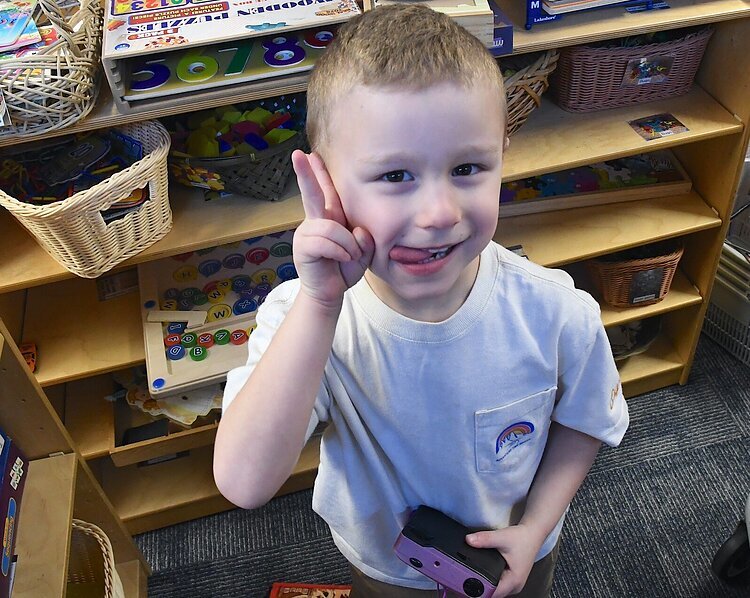 Rogen poses for a picture at Garden of Dreams Preschool in Battle Creek.