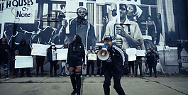 Flint native Coach Keith Smith pictured in the video for his song "Another Down" which speaks on police brutality plaguing the Black community. 