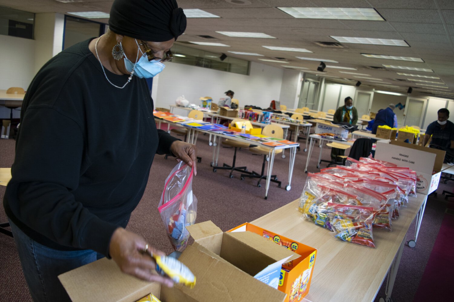 Eartha Logan, a member of Flint Residents for Good puts together goodie bags for Flint's special education children.