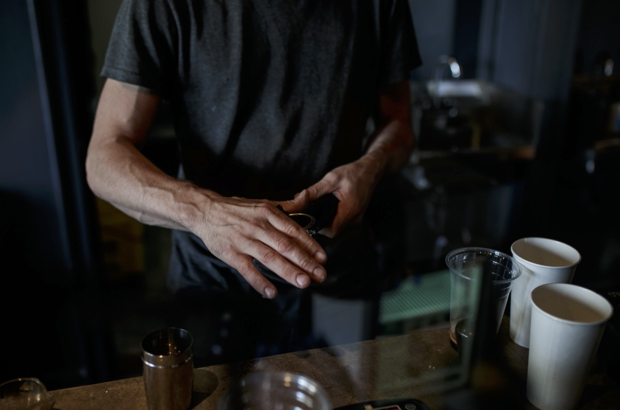 Timothy Goodrich prepares coffee at Dorothy's House of Coffee in East Village.