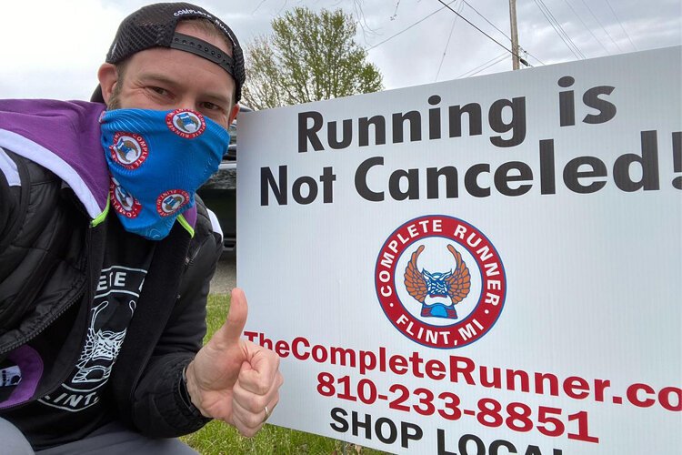 Complete Runner posted yard signs around Flint reminding people that they can still get out and run safely.