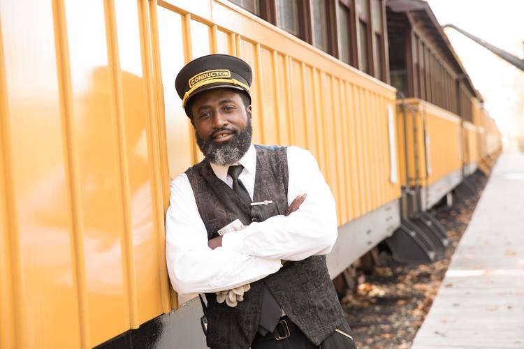 As a conductor for the Huckleberry Railroad, Larry Coleman hosts guests, ensures their safety, makes sure every trip runs smoothly—and throws in a little storytelling as the train chugs along its 40-minute route.