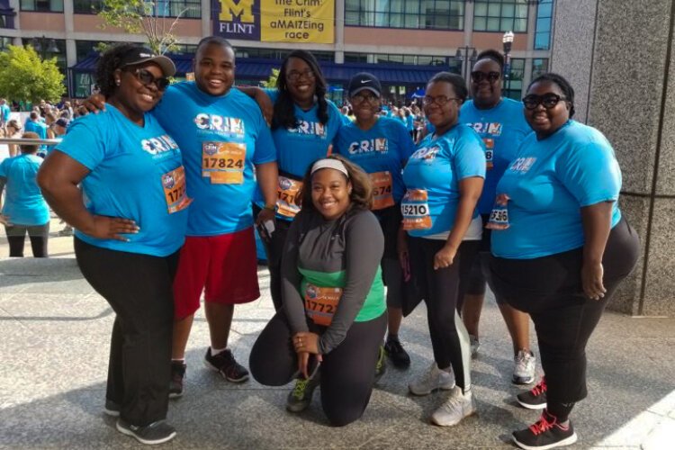 The 2017 Brownell-Holmes CrimFit Adult Training Program team poses for a picture before the race.