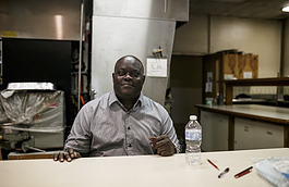 Kevin Croom, director of operations at Asbury Church, is pictured sitting inside the kitchen of Asbury Farms.