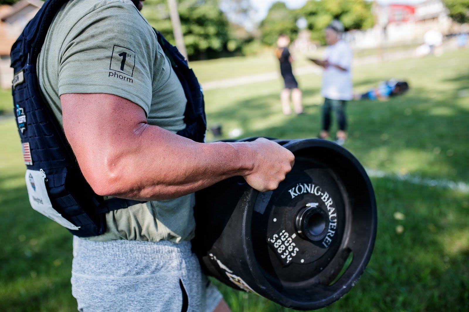 Weighted Challenge participant Donald Stilson lifts a 55-pound keg for the CrossFlint 5K Challenge during the 45th annual Crim Festival of Races in downtown Flint.